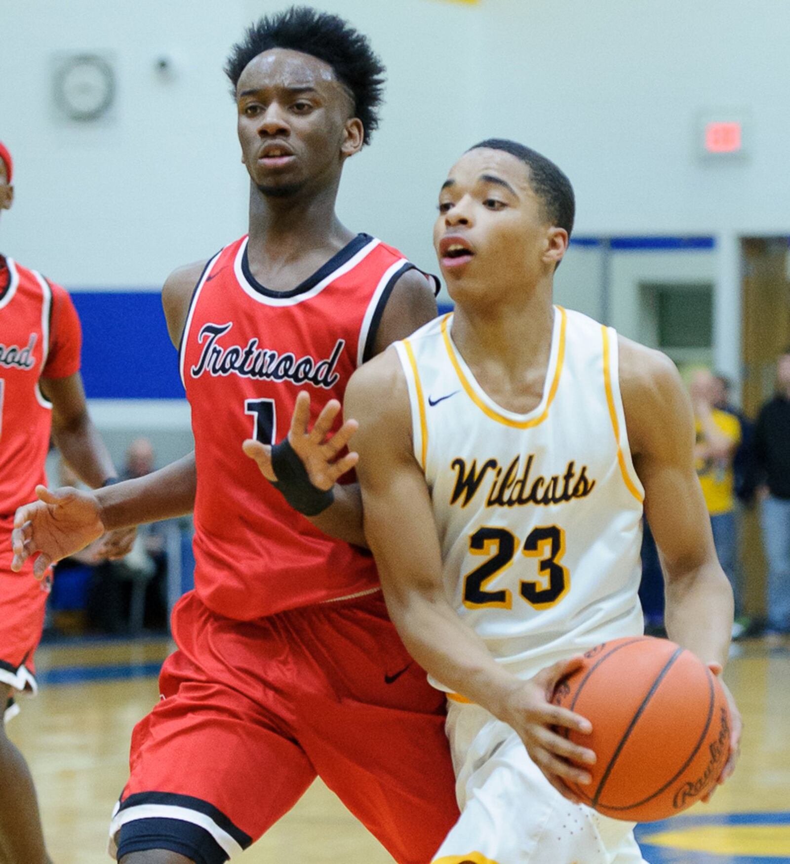 Springfield sophomore forward RaHeim Moss dribbles with pressure from Trotwood’s Amari Davis during a game on Friday night. BRYANT BILLING / CONTRIBUTED