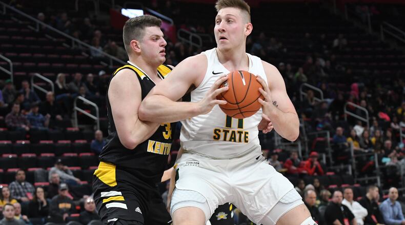 Wright State’s Loudon Love looks to score on Northern Kentucky’s Drew McDonald during the Horizon League tournament championship game. Keith Cole/CONTRIBUTED