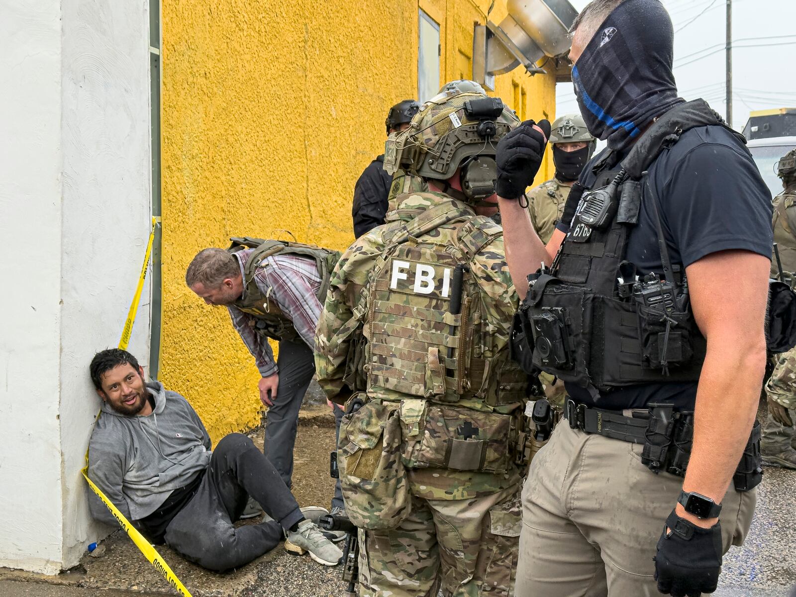 Federal agents detain a man during an operation, Tuesday, June 3, 2025, in Minneapolis, Minn. (Kerem Yücel/Minnesota Public Radio via AP)