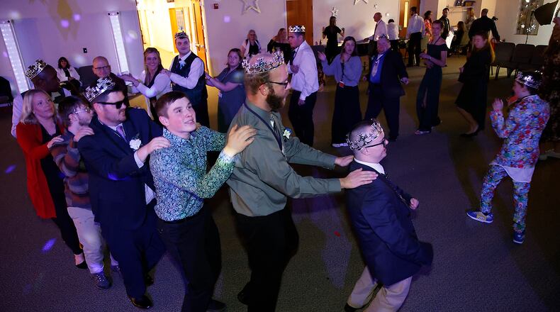 The Night to Shine prom for individuals with special needs was held at the Lawrenceville Church of God Friday, Feb. 9, 2024. Night to Shine is for anyone over age 14 with special needs and is hosted by churches around the world. This year's event included a red carpet entrance, limousine rides, dancing, karaoke, gifts, a catered dinner and a respite room for parents and caregivers. BILL LACKEY/STAFF