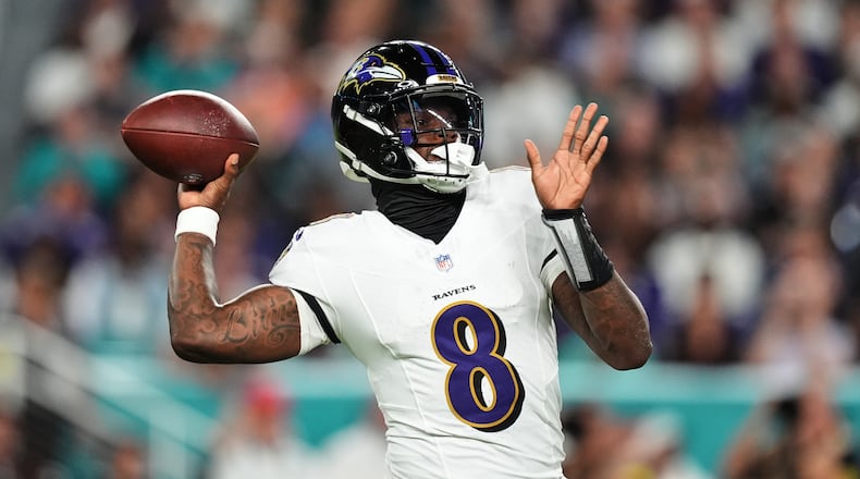 Baltimore Ravens quarterback Lamar Jackson (8) throws against the Miami Dolphins during the first half of an NFL football game, Thursday, Oct. 30, 2025, in Miami Gardens, Fla. (AP Photo/Rebecca Blackwell)