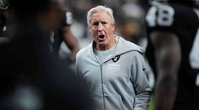 Las Vegas Raiders head coach Pete Carroll watches his team warm up before an NFL football game against the Kansas City Chiefs Sunday, Jan. 4, 2026, in Las Vegas. (AP Photo/John Locher)