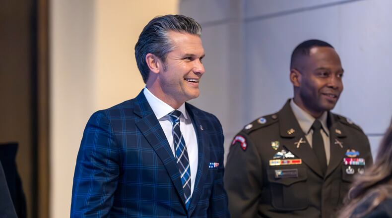 Defense Secretary Pete Hegseth smiles as he walks to a secure room in the basement of the Capitol to brief lawmakers on how he handled a military strike on a suspected drug smuggling boat and its crew in the Caribbean near Venezuela Sept. 2, at the Capitol in Washington, Tuesday, Dec. 9, 2025. (AP Photo/J. Scott Applewhite)