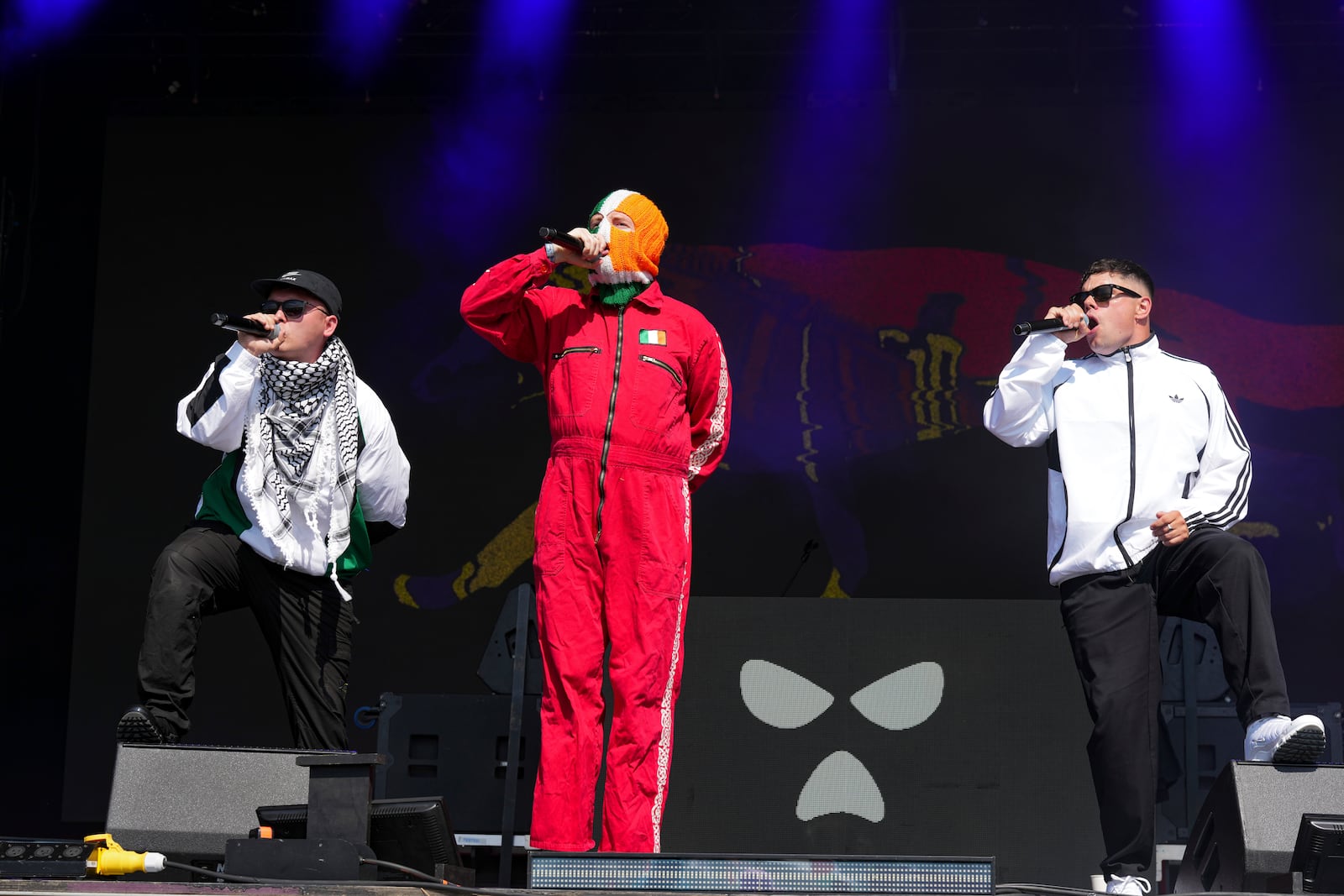 Hip hop trio Kneecap perform during the Glastonbury Festival in Worthy Farm, Somerset, England, Saturday, June 28, 2025. (Scott A Garfitt/Invision/AP)