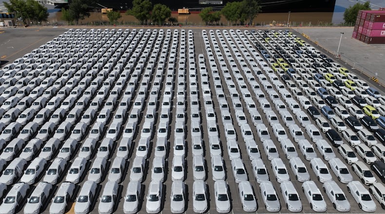 The BYD Changzhou car carrier is docked at Terminal Zarate in the Buenos Aires province of Argentina, Tuesday, Jan. 20, 2026, where hybrid and electric vehicles shipped from China are parked next to the ship. (AP Photo/Victor R. Caivano)