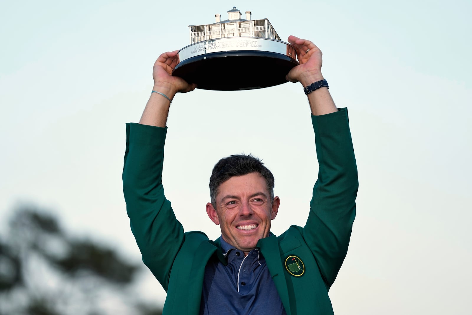 Winner Rory McIlroy, of Northern Ireland, holds the trophy at the Masters golf tournament, Sunday, April 13, 2025, in Augusta, Ga. (AP Photo/Ashley Landis)