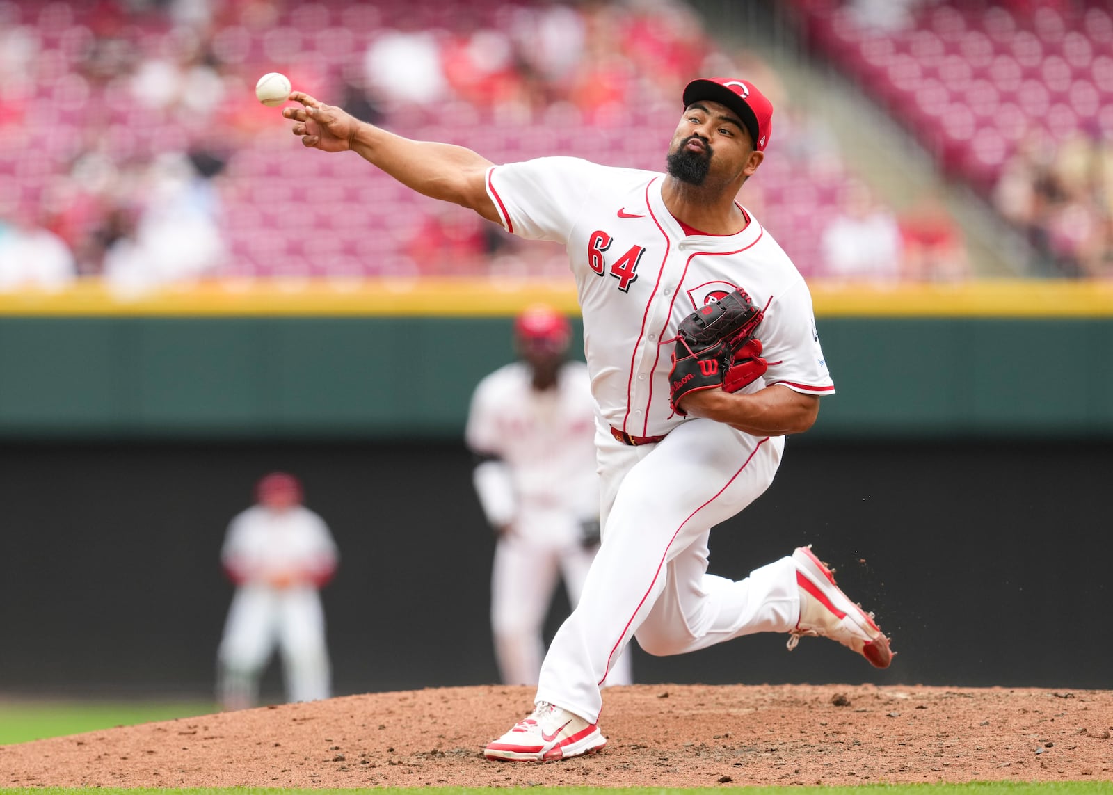 Cincinnati Reds pitcher Tony Santillan throws during the tenth inning of a baseball game against the Arizona Diamondbacks, that was suspended Friday because of rain and resumed, Saturday, June 7, 2025, in Cincinnati. (AP Photo/Jeff Dean)