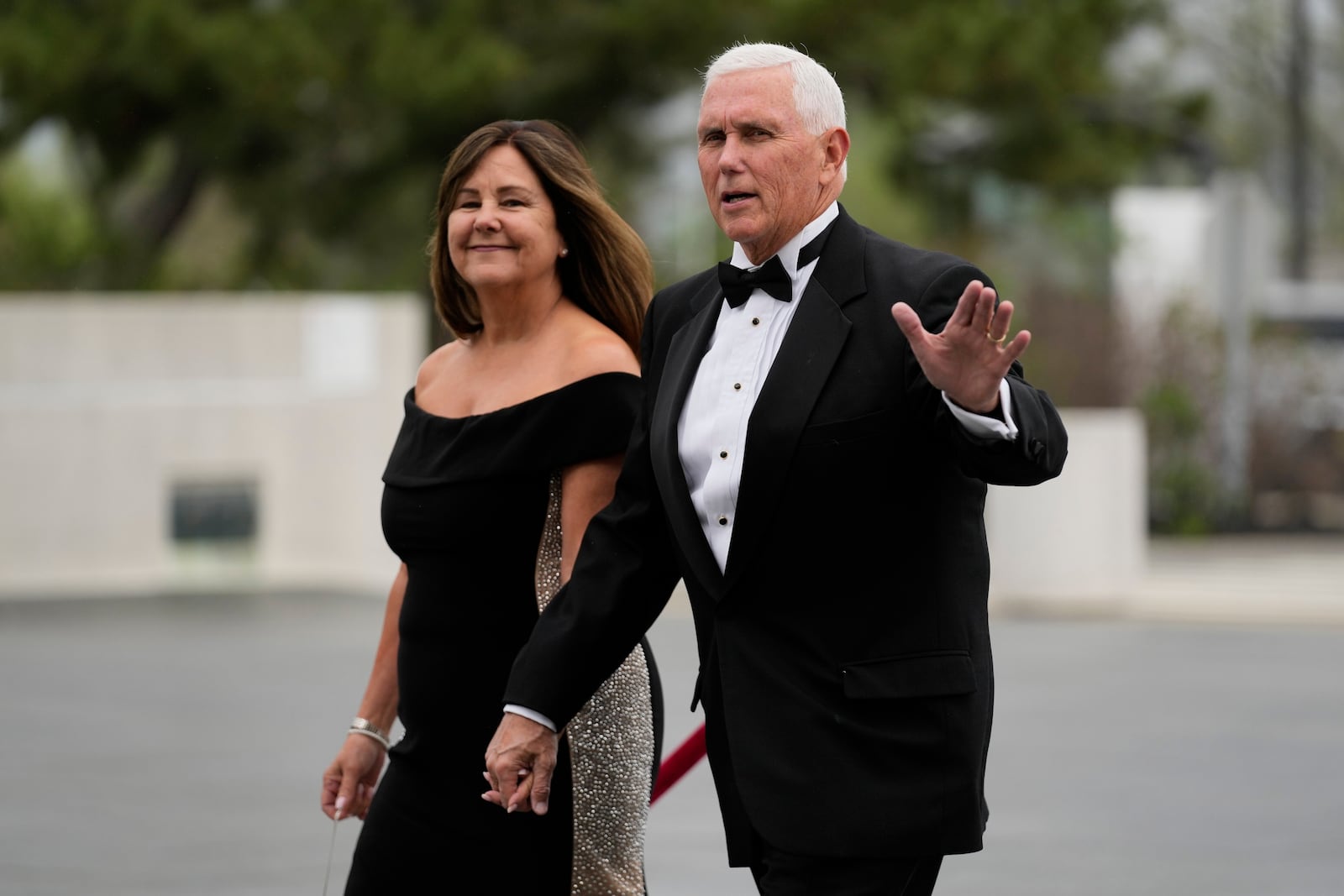 Former Vice President Mike Pence arrives with his wife, Karen Pence, at the JFK Library where he will receive the John F. Kennedy Profile in Courage Award, Sunday, May 4, 2025, in Boston. (AP Photo/Robert F. Bukaty)