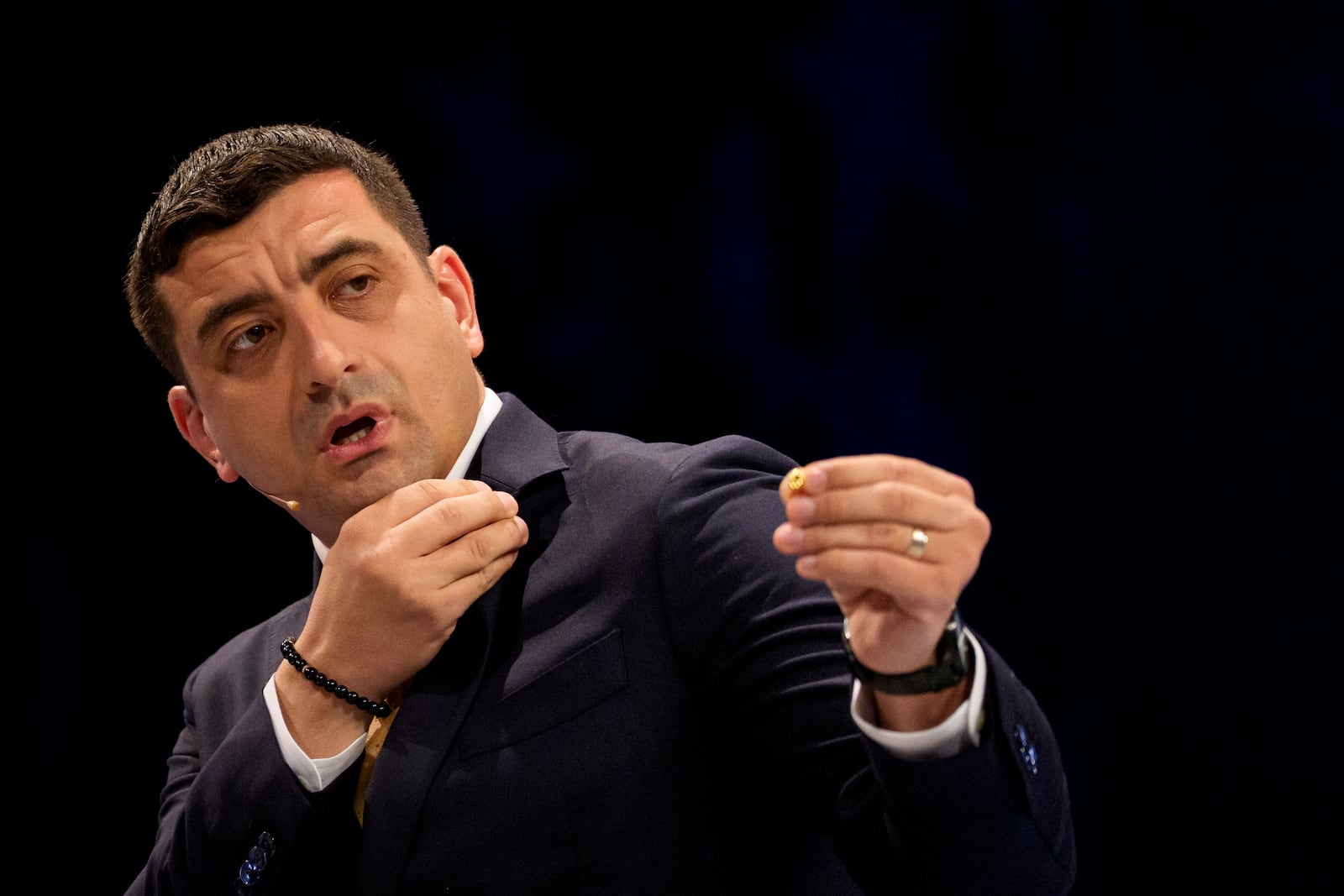 FILE - Presidential candidate George Simion gestures during a live electoral debate with presidential candidate Nicusor Dan ahead of the second round of the country's presidential election redo in Bucharest, Romania, Thursday, May 8, 2025. (AP Photo/Andreea Alexandru, File)