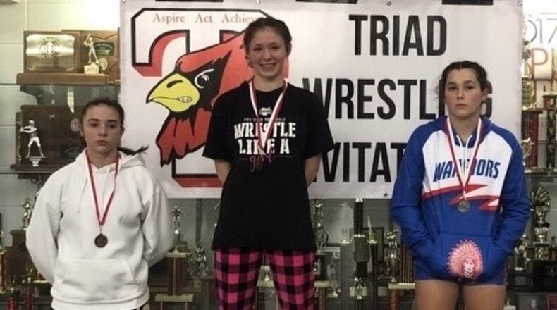Greenon girls wrestler Naura Simison stands atop the podium after the Triad Wrestling Invitational. CONTRIBUTED PHOTO