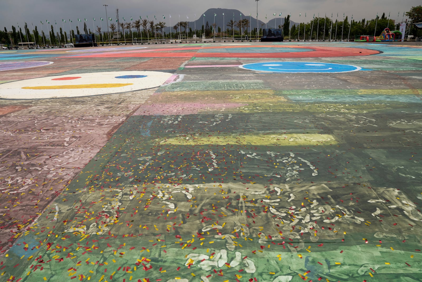 An Ariel view of the canvas painting by Kanyeyachukwu Tagbo-Okeke, a 15-year-old autistic artist who won the Guinness World Record for the largest art canvas, on display at the Eagle Square on World Autism Day in Abuja, Nigeria, Wednesday, April 2, 2025. (AP Photo/David Durowaiye)