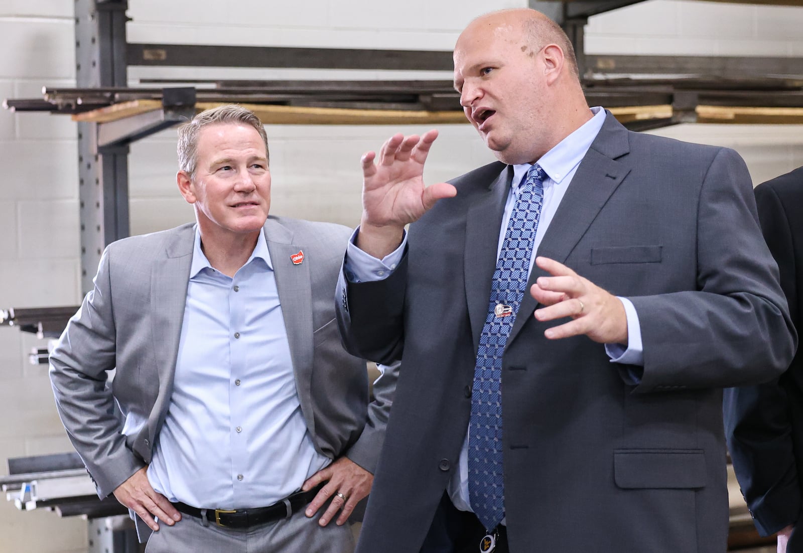 Sen. Jon Husted (left) listens as Stebbins High School assistant principal Jeff Berk talks about the school's career technology center on Friday, Sept. 5 in Riverside.. Husted toured the school's CTC. BRYANT BILLING / STAFF