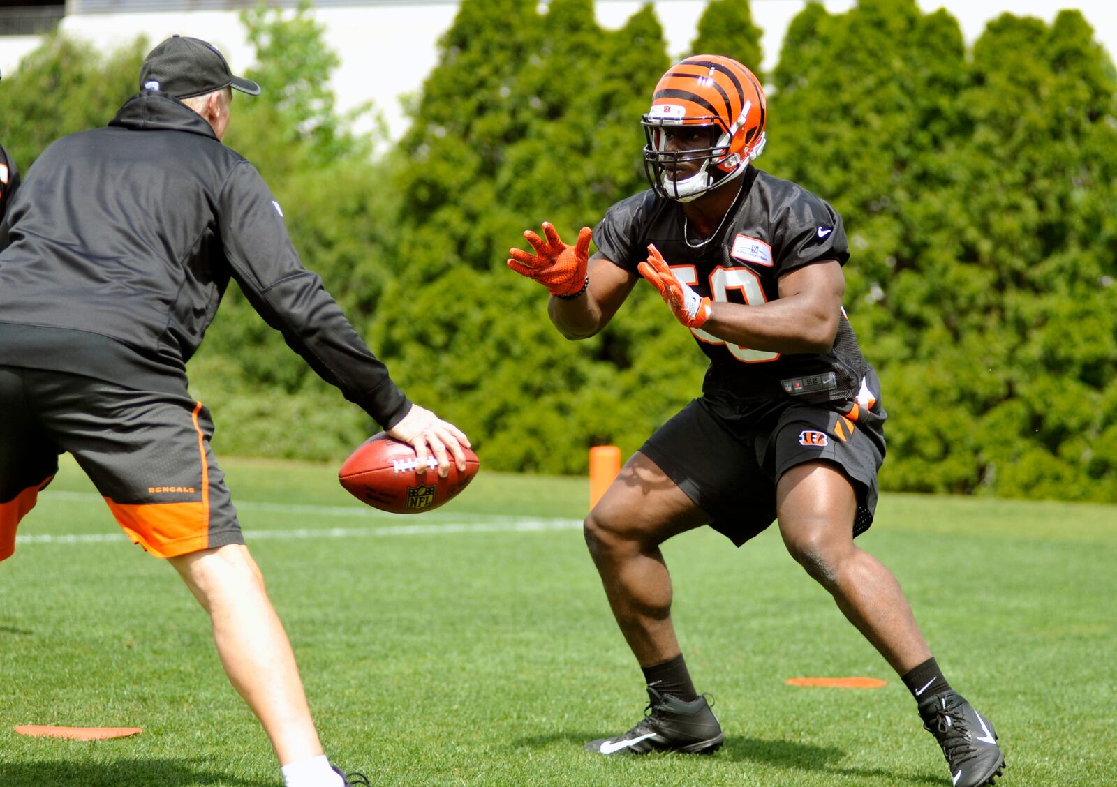 Cincinnati Bengals fourth-round pick Carl Lawson works during rookie camp at Paul Brown Stadium. Jay Morrison/Staff