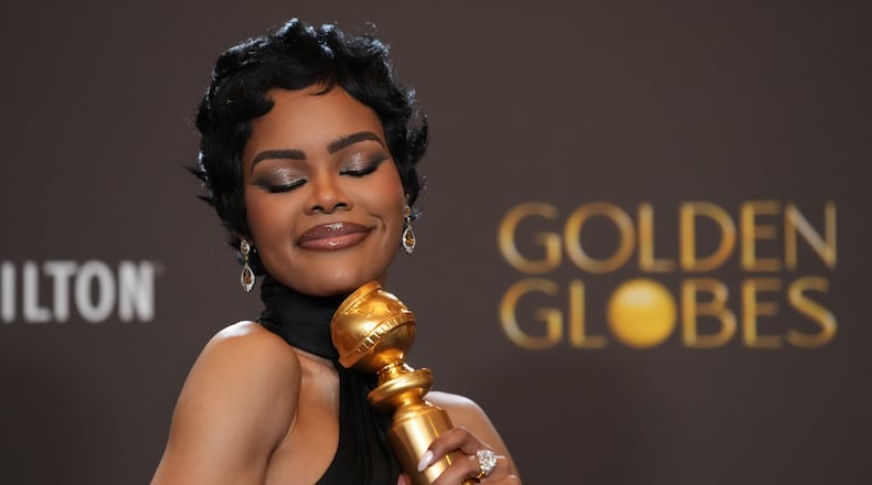 Teyana Taylor poses in the press room with the award for best performance by a female actor in a supporting role in any motion picture for "One Battle After Another" during the 83rd Golden Globes on Sunday, Jan. 11, 2026, at the Beverly Hilton in Beverly Hills, Calif. (AP Photo/Chris Pizzello)