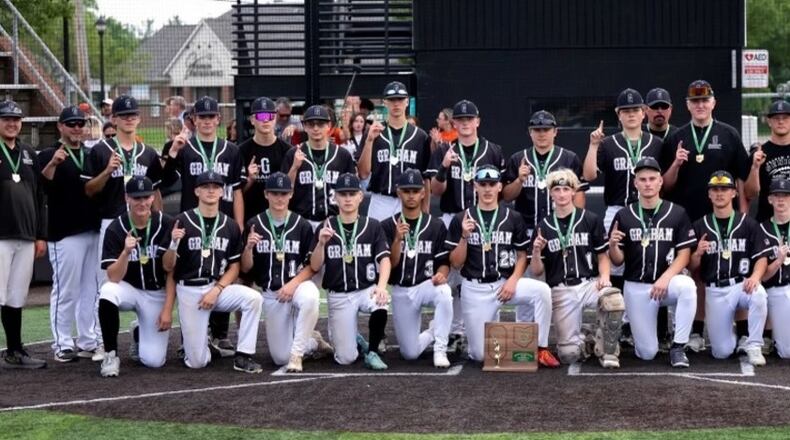 The Graham High School baseball team poses with a Division V regional championship trophy after beating Ironton 5-1 on June 4 at Mason High School. The Falcons advanced to the state tournament for the first time in 30 years. CONTRIBUTED PHOTO