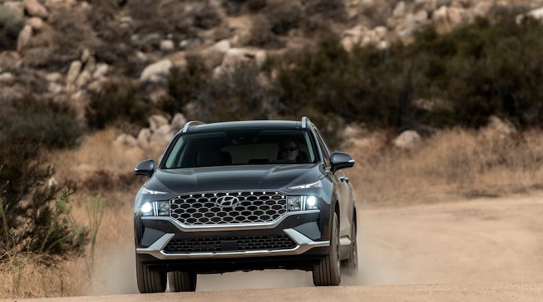 This photo provided by Hyundai shows the 2021 Santa Fe with new styling, upgraded available engines and a lot of equipment at an attractive price. (Drew Phillips/Courtesy of Hyundai Motor America via AP)