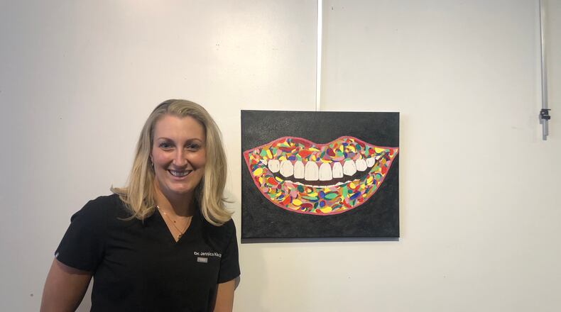 Jessica Kile is showing off a smile in the Champaign County Arts Council revival of one of its most popular fundraisers on May 7 with Bad Art by Good People, featuring a dinner and auction to bid on pieces created by local celebrities. Courtesy photo