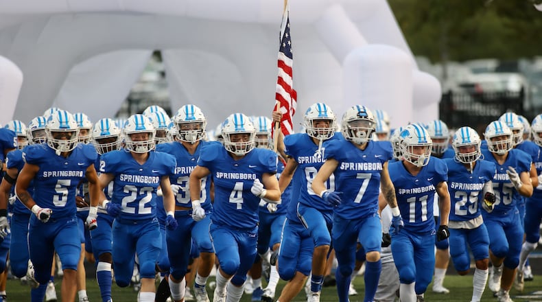 Springboro takes the field before a game against Centerville on Friday, Sept. 23, 2022, at CareFlight Field in Springboro. David Jablonski/Staff