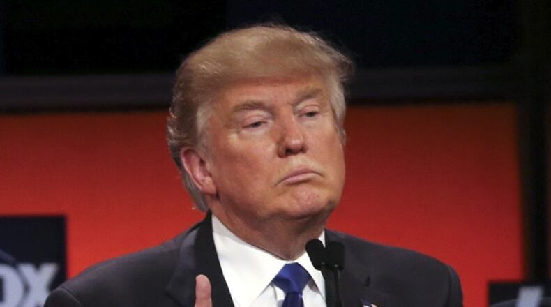 Donald Trump reacts as Sen. Marco Rubio speaks during a Republican presidential debate hosted by Fox News in Detroit, March 3, 2016. (Richard Perry/The New York Times)