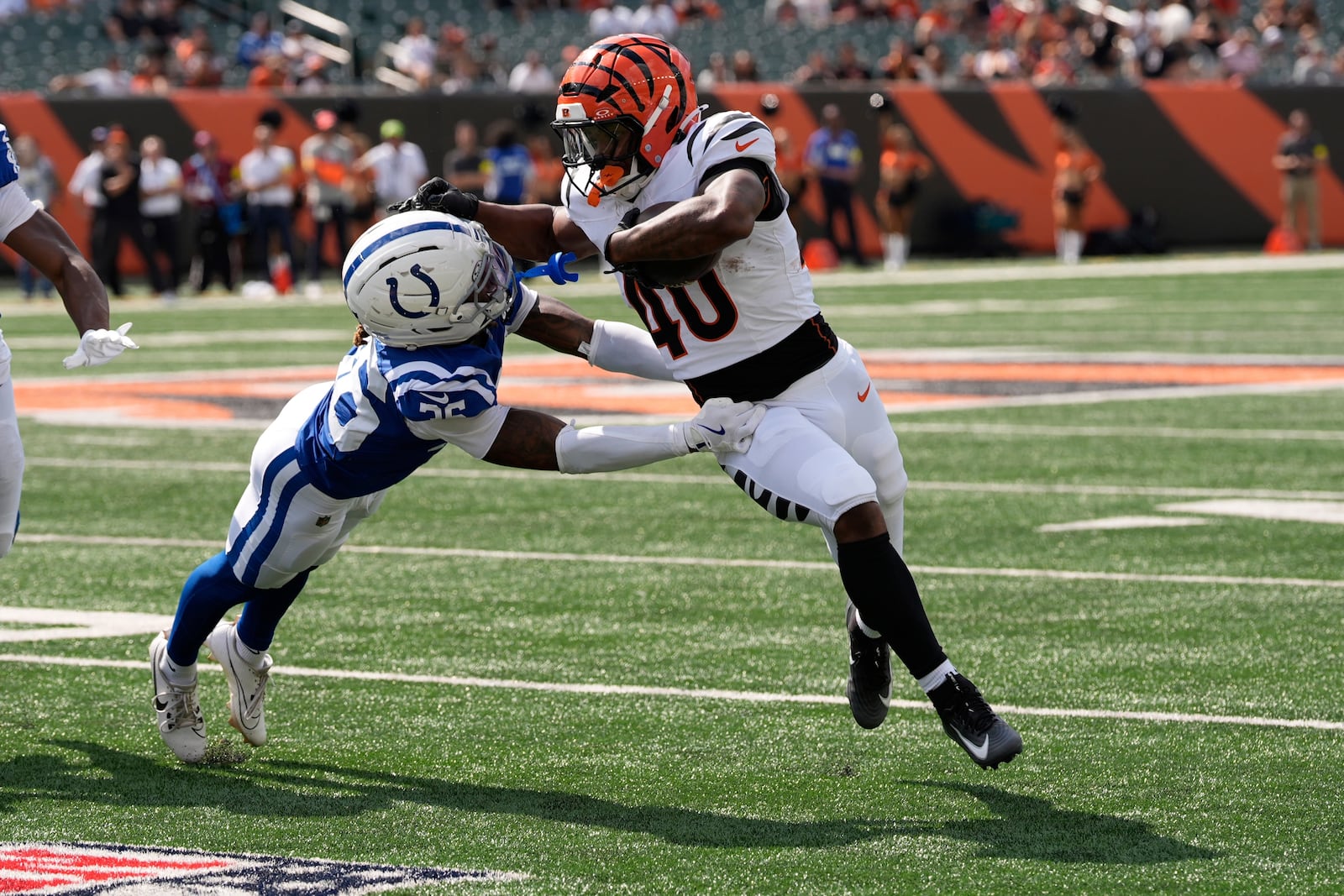 Cincinnati Bengals' Quali Conley (40) runs past Indianapolis Colts' BJ Mayes (36) during the second half of a preseason NFL football game, Saturday, Aug. 23, 2025, in Cincinnati. (AP Photo/Carolyn Kaster)