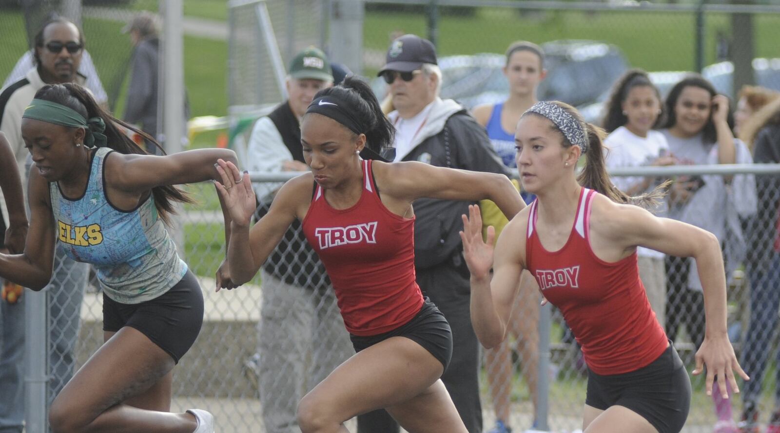 Jasmine Broner (Centerville, left), Celina Courts (Troy) and Ashley Barr (Troy) in the 100 during the GWOC track and field championships at Troy’s Memorial Stadium on Friday, May 12, 2017. MARC PENDLETON / STAFF