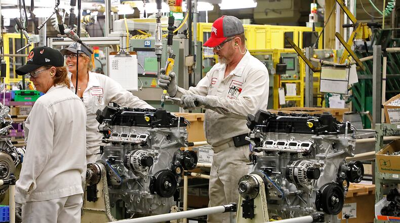 Honda associates assemble engines on the line at the engine plant in Anna in October 2017. Bill Lackey/Staff