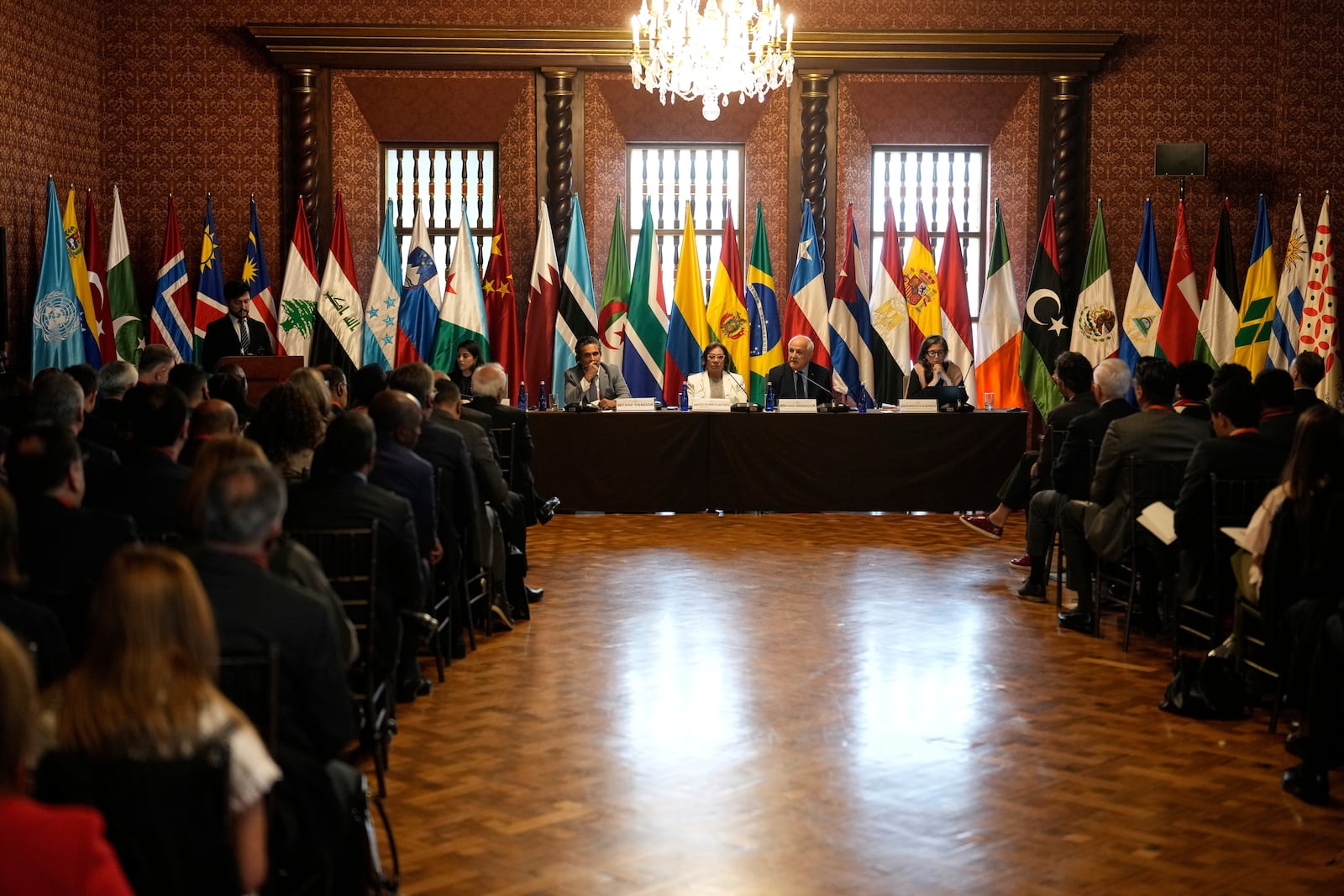 Riyad Mansour, Palestinian U.N. ambassador, top, second from right, speaks in Bogota, Colombia, Tuesday, July 15, 2025, during a two-day conference to address the Israel-Hamas war and Israel's military actions in Gaza. Second from left at the table is Colombian Foreign Minister Rosa Yolanda Villavicencio. At far right at table is U.N. Special Rapporteur for the Occupied Palestinian Territories Francesca Albanese. At far left at table is Zane Dangor, South Africa's Foreign Minister. (AP Photo/Fernando Vergara)