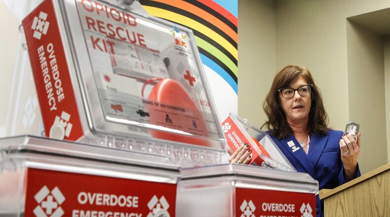 Barbara Marsh, Assistant to the Health Commissioner, Public Health -- Dayton & Montgomery County, pictured in early 2020, shows new opioid rescue kits containing naloxone. CHRIS STEWART / STAFF