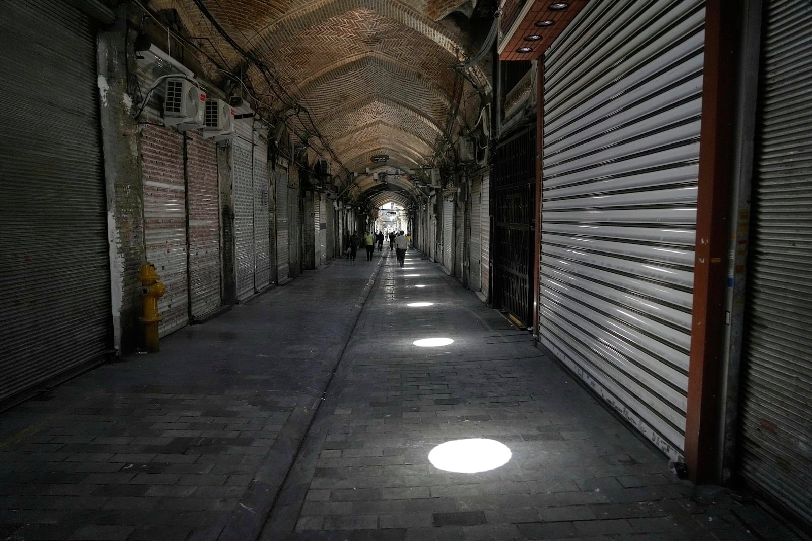 Shops remain shuttered Tehran's historic Grand Bazaar, Monday, June 16, 2025. (AP Photo/Vahid Salemi)