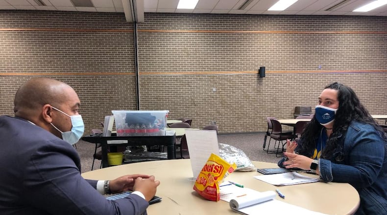Clark State College students Daniel Constancio and Sami Walker discuss skills they took away Friday from the school's first Student Leadership Conference. About 25 attendees heard from speakers, participated in breakout sessions and group activities during the event. Photo by Brett Turner