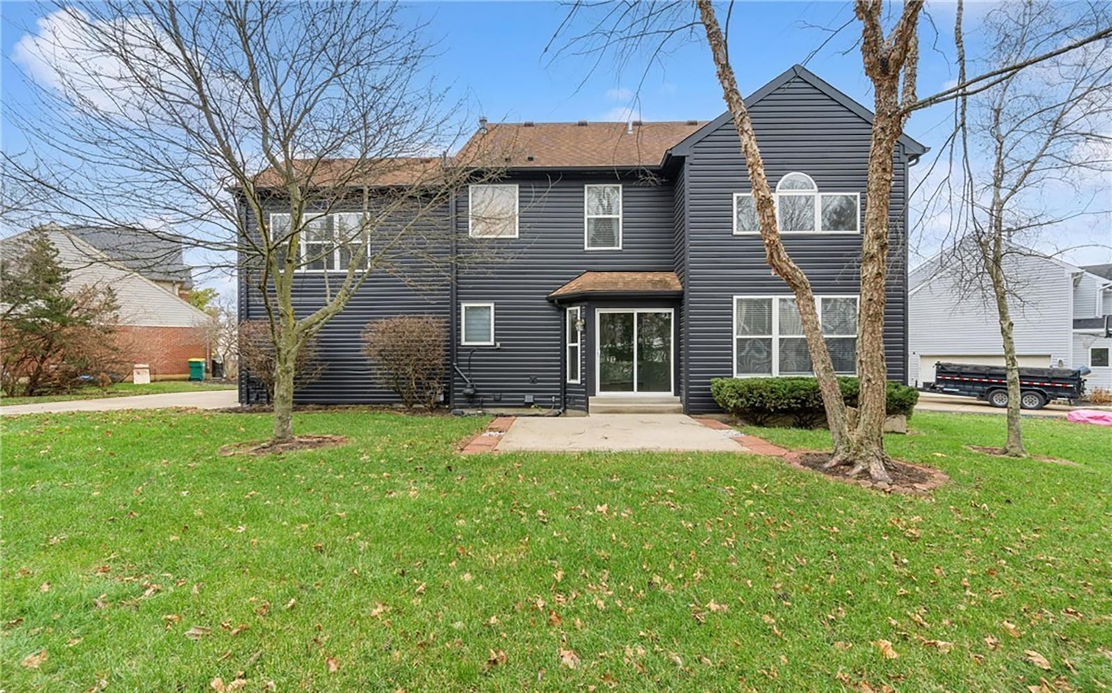 the back of the home has a concrete patio and stone fireplit. CONTRIBUTED