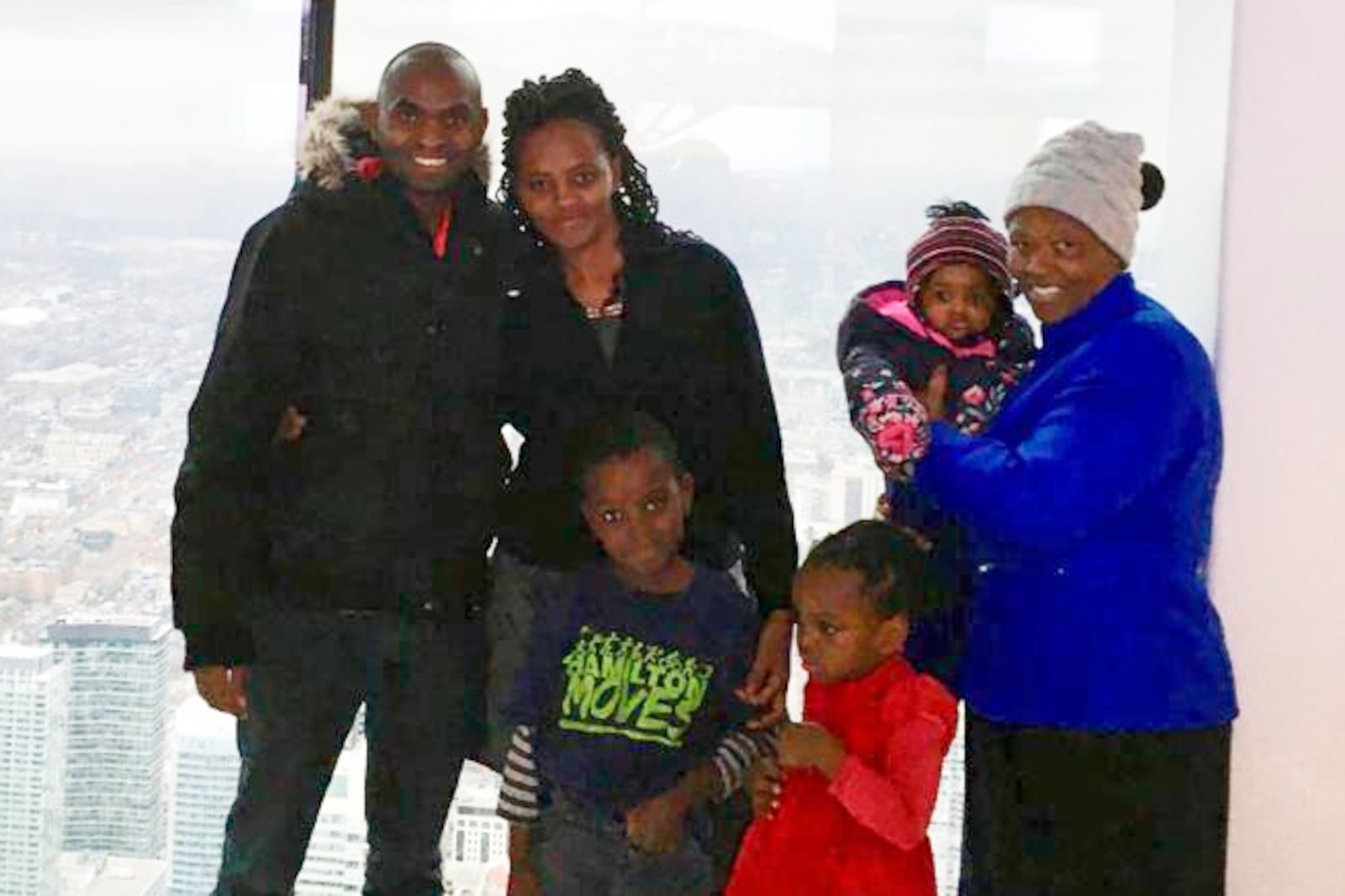 This photo taken in Toronto, in Dec. 2018, shows Paul Njoroge, his wife, Carolyne, and three small children, Ryan, age 6, Kellie, 4, and infant Rubi, along with Njoroge’s mother-in-law, Anne Wangui Karanja. (Clifford Law Offices via AP)