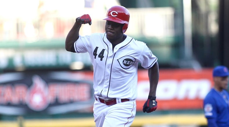 The Reds’ Aristides Aquino rounds the bases after a two-run home run in the second inning against the Cubs on Friday, Aug. 9, 2019, at Great American Ball Park in Cincinnati. David Jablonski/Staff