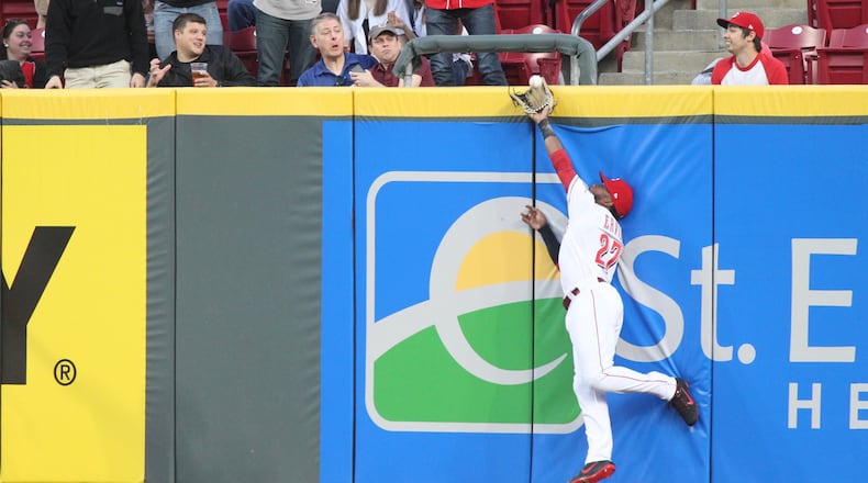 Reds right fielder Phillip Ervin makes a catch against the Cardinals on Thursday, April 12, 2018, at Great American Ball Park in Cincinnati.