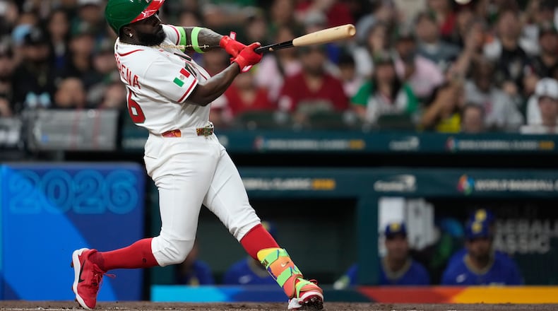 Mexico's Randy Arozarena doubles during the first inning of a World Baseball Classic game against Brazil, Sunday, March 8, 2026, in Houston. (AP Photo/Ashley Landis)