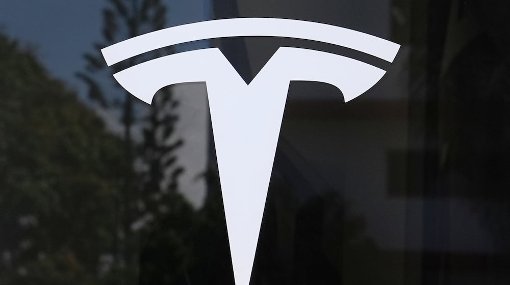 FILE - The Tesla logo is displayed at a Tesla dealership Thursday, Mar. 13, 2025, in Miami. (AP Photo/Lynne Sladky, File)