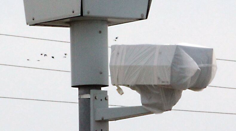 Plastic bags cover the red light cameras at the intersection of Bechtle Avenue and Troy Road in Springfield. The cameras were turned off in 2015. Jeff Guerini/Staff