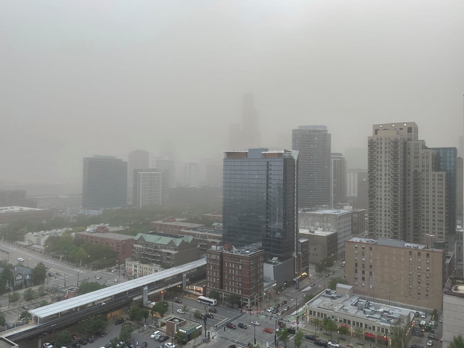 A dust storm that originated in central Illinois moves through downtown Chicago on the evening of Friday, May 16, 2025. (AP Photo/Kathleen Foody)