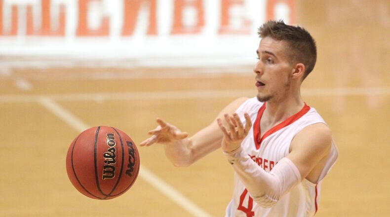 Wittenberg’s Jordan Pumroy passes against DePauw on Wednesday, Jan. 24, 2018, at Pam Evans Smith Arena in Springfield. David Jablonski/Staff