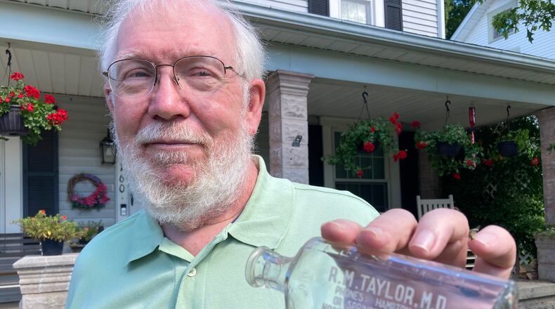 John Bartley prizes a bottle he acquired from Springfield water dealer M. Spangler. Contributed