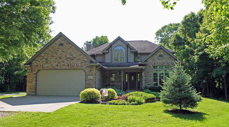 This 4-bedroom property includes 5.19 acres and has a 60-by-64-foot outbuilding with tall overhead doors and a heated space. CONTRIBUTED PHOTO BY VICKIE KAPNAS