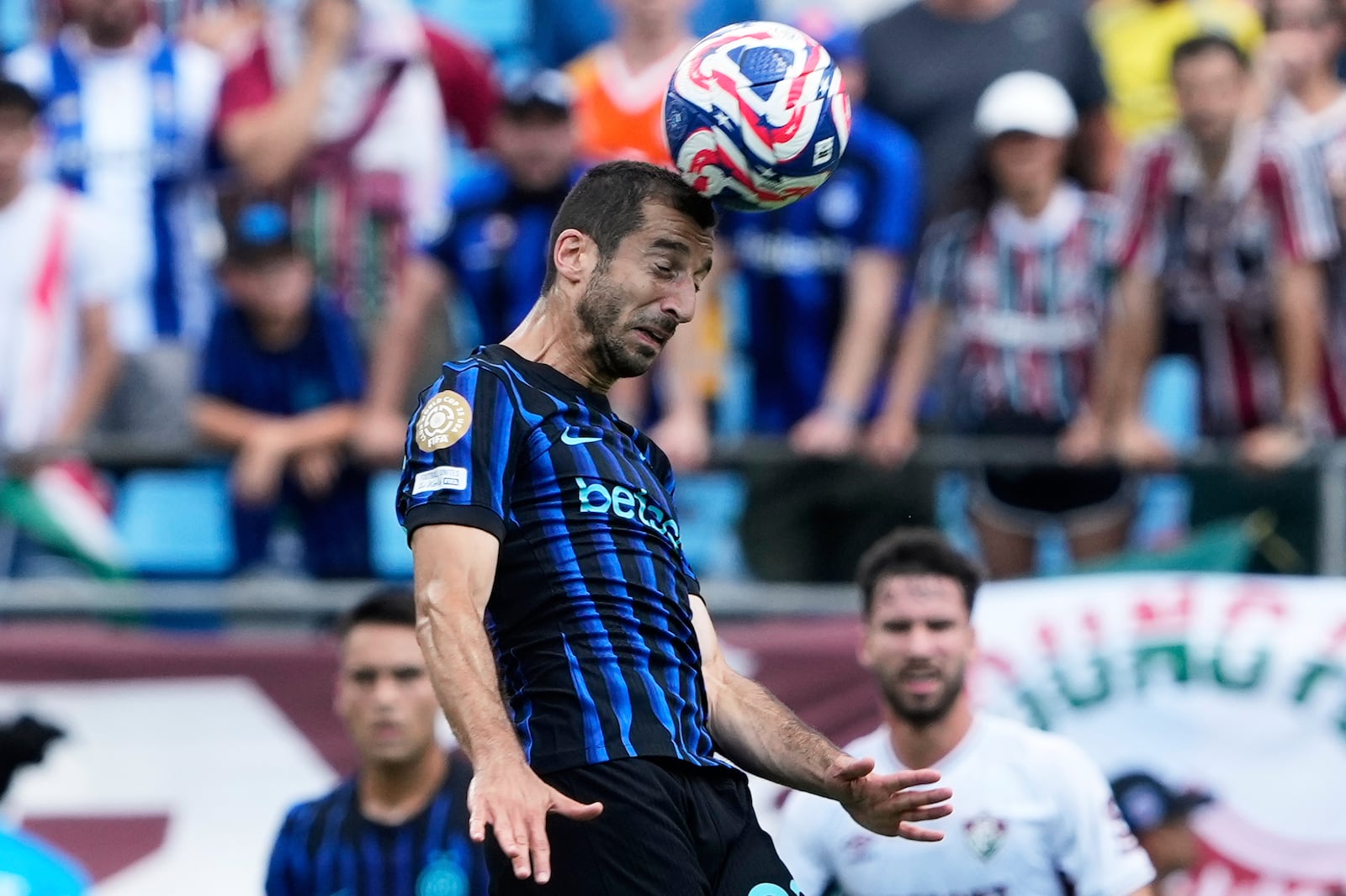 Inter Milan's Henrikh Mkhitaryan heads the ball during the Club World Cup round of 16 soccer match between Inter Milan and Fluminense in Charlotte, N.C., Monday, June 30, 2025. (AP Photo/Chris Carlson)