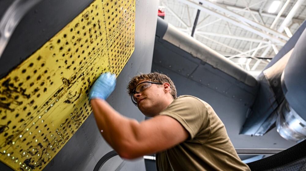 U.S. Air Force Staff Sgt. London Foreman, 445th Maintenance Squadron aircraft structural maintenance journeyman, performs an exterior aircraft skin repair on C-17 Globemaster III at Wright Patterson Air Force Base on July 17, 2025. Air Force photo by Staff Sgt. Johnathan Quiñones