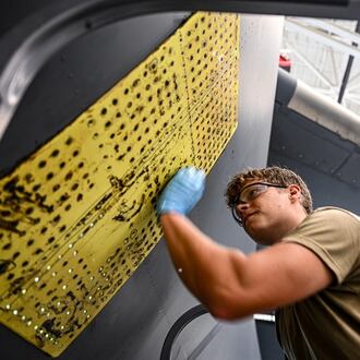 U.S. Air Force Staff Sgt. London Foreman, 445th Maintenance Squadron aircraft structural maintenance journeyman, performs an exterior aircraft skin repair on C-17 Globemaster III at Wright Patterson Air Force Base on July 17, 2025. Air Force photo by Staff Sgt. Johnathan Quiñones