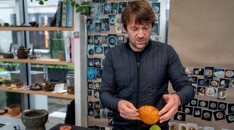 Noma's chef René Redzepi prepares a vegetarian burger in a restaurant, in Copenhagen, Nov. 24, 2024. (Soeren Bidstrup/Ritzau Scanpix via AP)