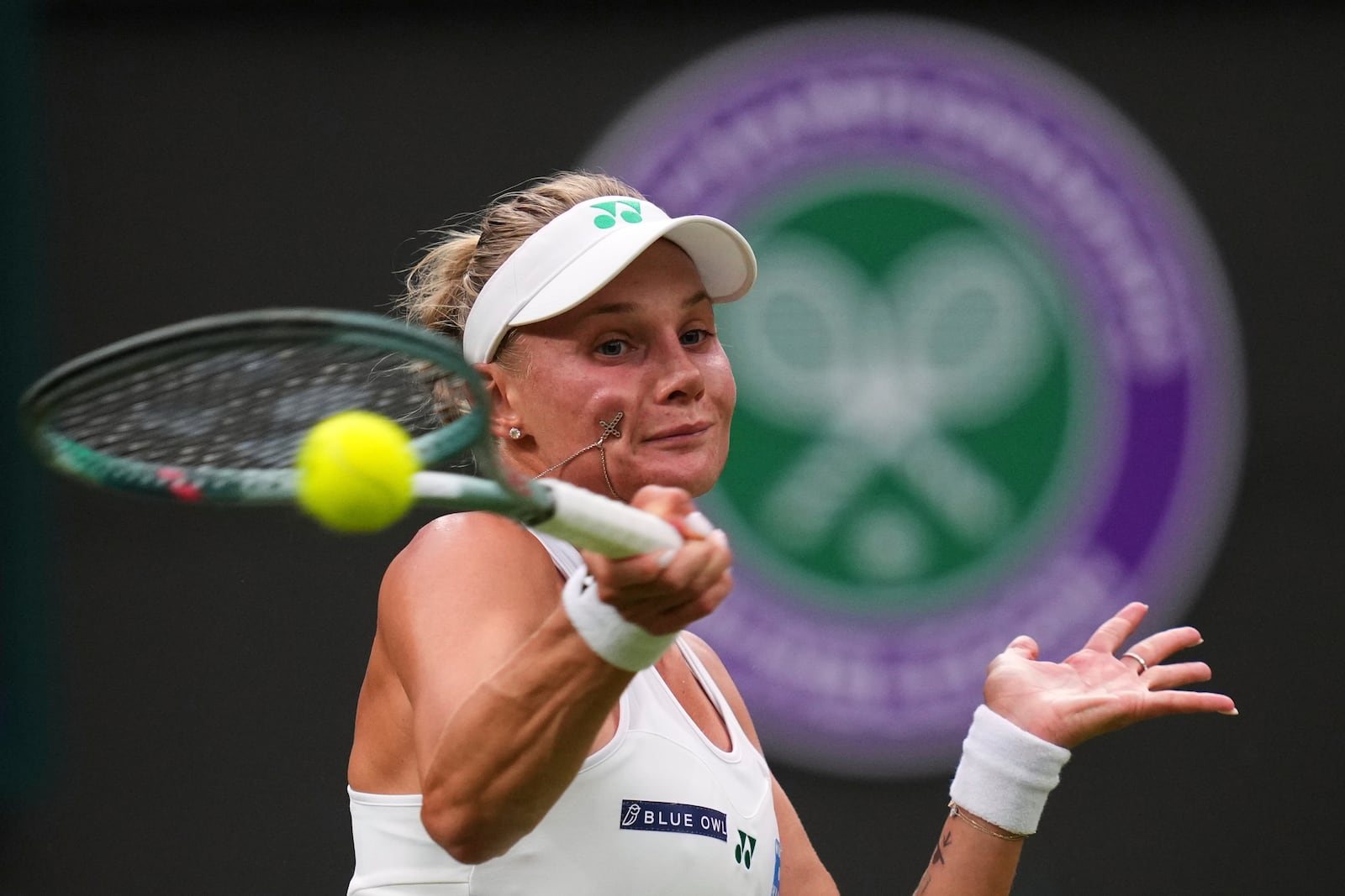 Dayana Yastremska of Ukraine returns the ball to Coco Gauff of the U.S. during their first round women's single match at the Wimbledon Tennis Championships in London, Tuesday, July 1, 2025.(AP Photo/Kirsty Wigglesworth)