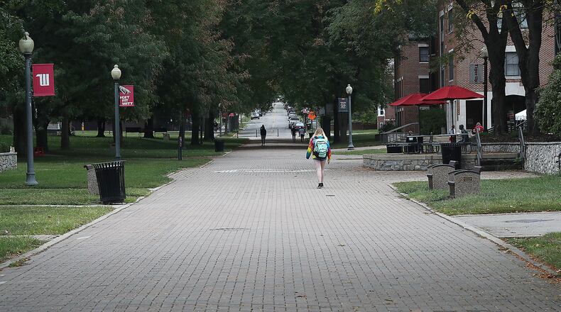 Only a few students walked around on campus at Wittenberg University last month. BILL LACKEY/STAFF