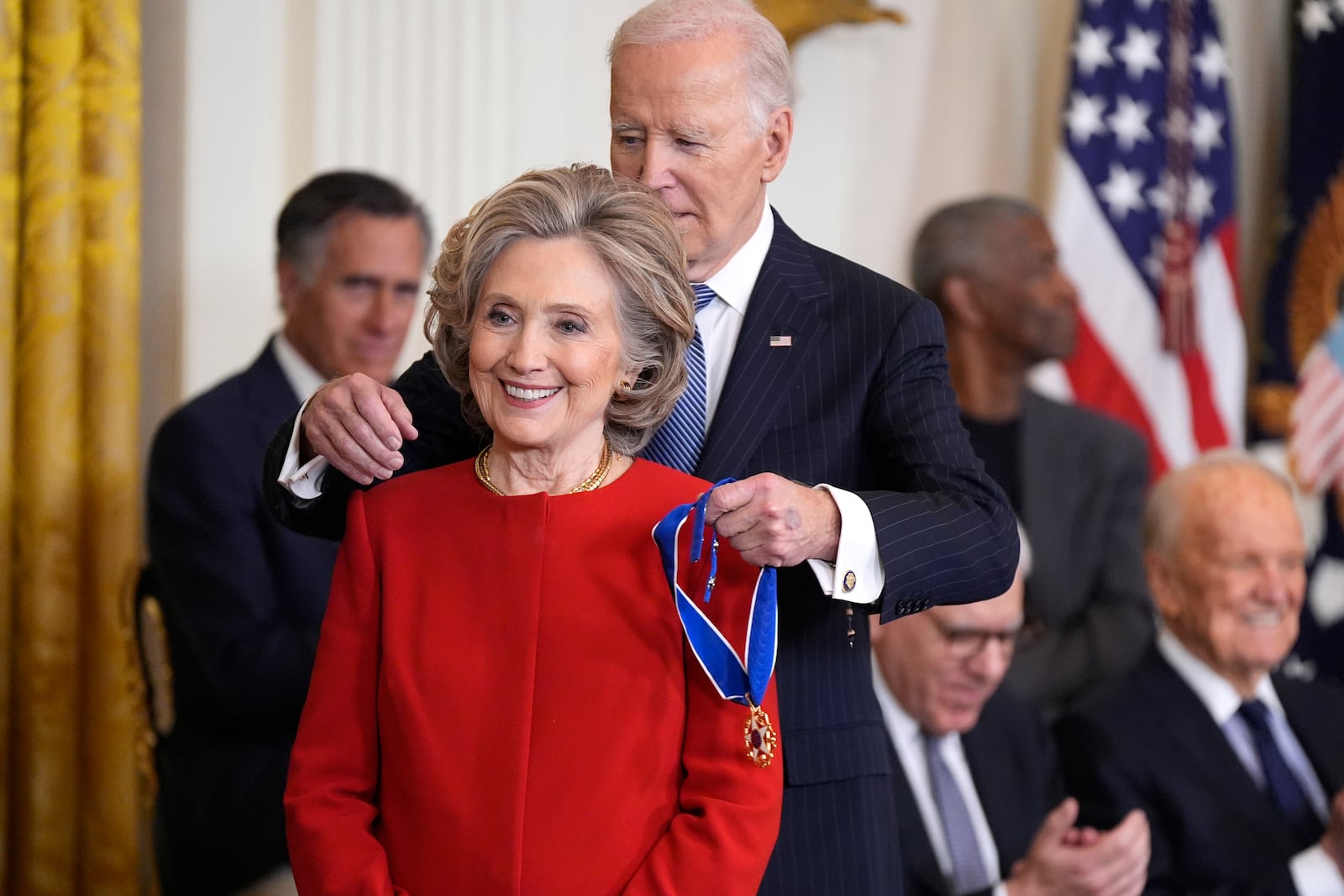 FILE - President Joe Biden, right, presents the Presidential Medal of Freedom, the Nation's highest civilian honor, to former Secretary of State Hillary Clinton, in the East Room of the White House, Jan. 4, 2025, in Washington. (AP Photo/Manuel Balce Ceneta, File)
