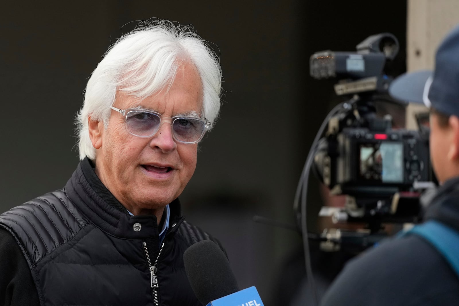 Trainer Bob Baffert does an interview outside his barn at Churchill Downs Monday, April 28, 2025, in Louisville, Ky. (AP Photo/Charlie Riedel)