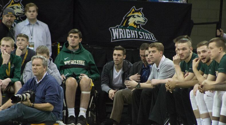 Former Wright State teammates Ryan Custer and Mike LaTulip during Friday night’s game at the Nutter Center. ALLISON RODRIGUEZ / CONTRIBUTED